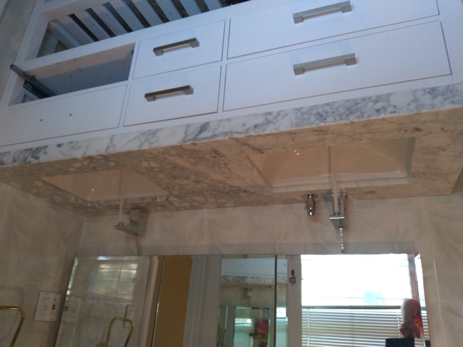 Custom double-sink marble vanity and tile work