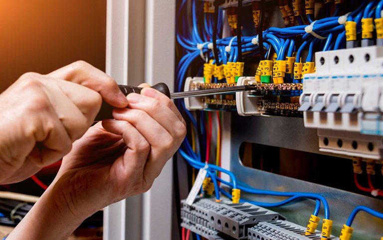 Electrician working on an electrical panel in Staten Island